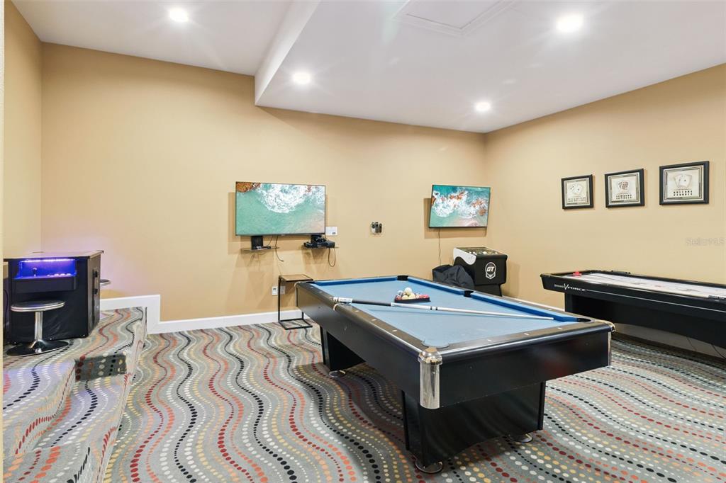 7423 Sparkling Court Reunion, FL 34747 - Photo 10 of 62 a room with furniture and a wooden floor