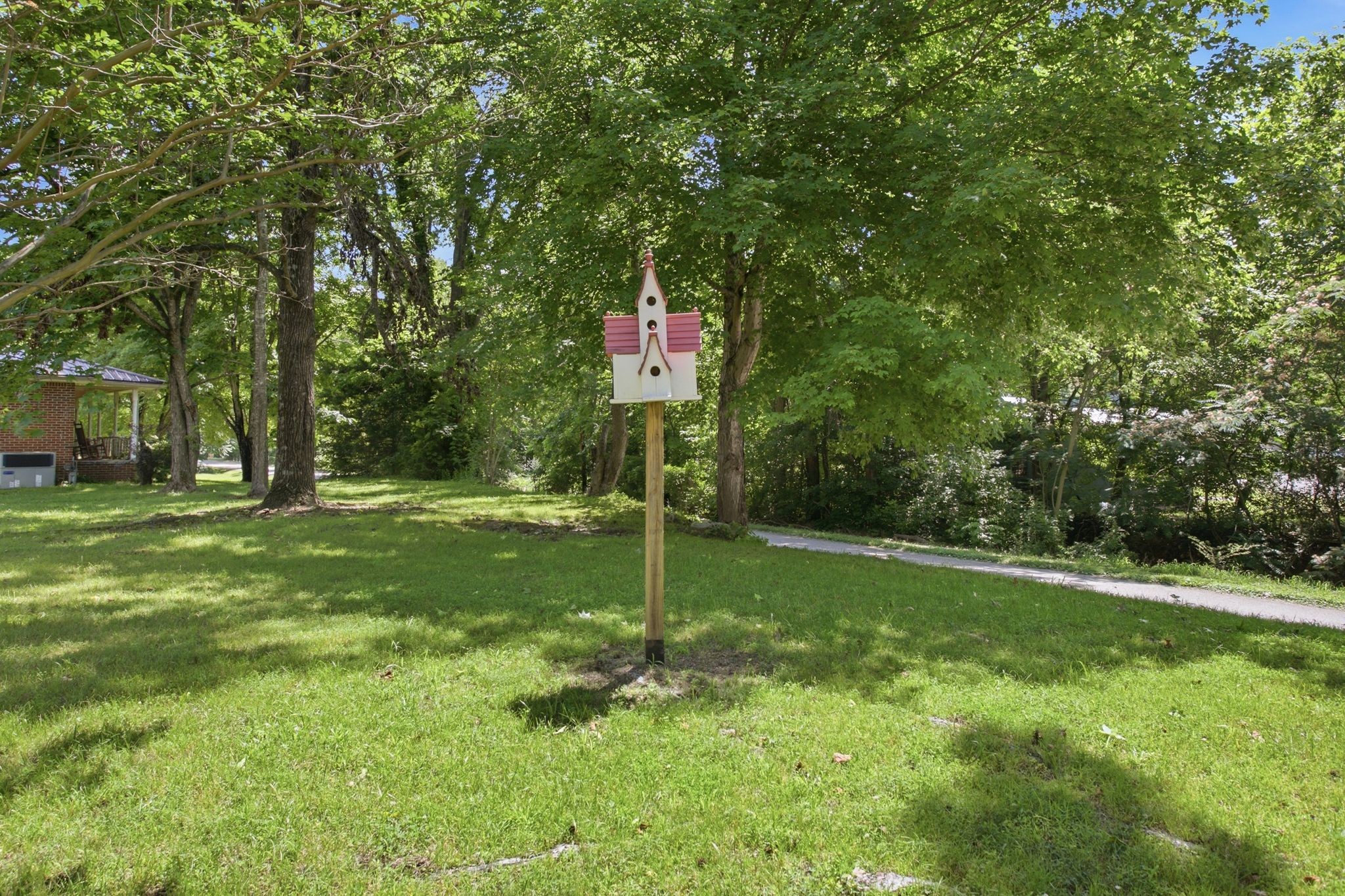 150 Toms Creek Road Linden, TN 37096 - Photo 23 of 23 a flag is sitting in the middle of a yard