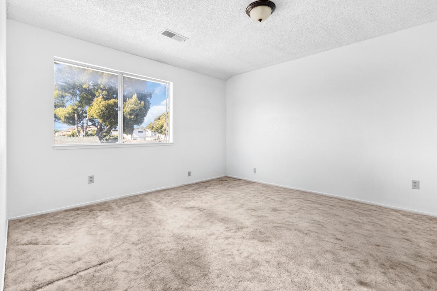 967 Hilby Avenue, Unit C Seaside, CA 93955 - Photo 11 of 24 an empty room with windows