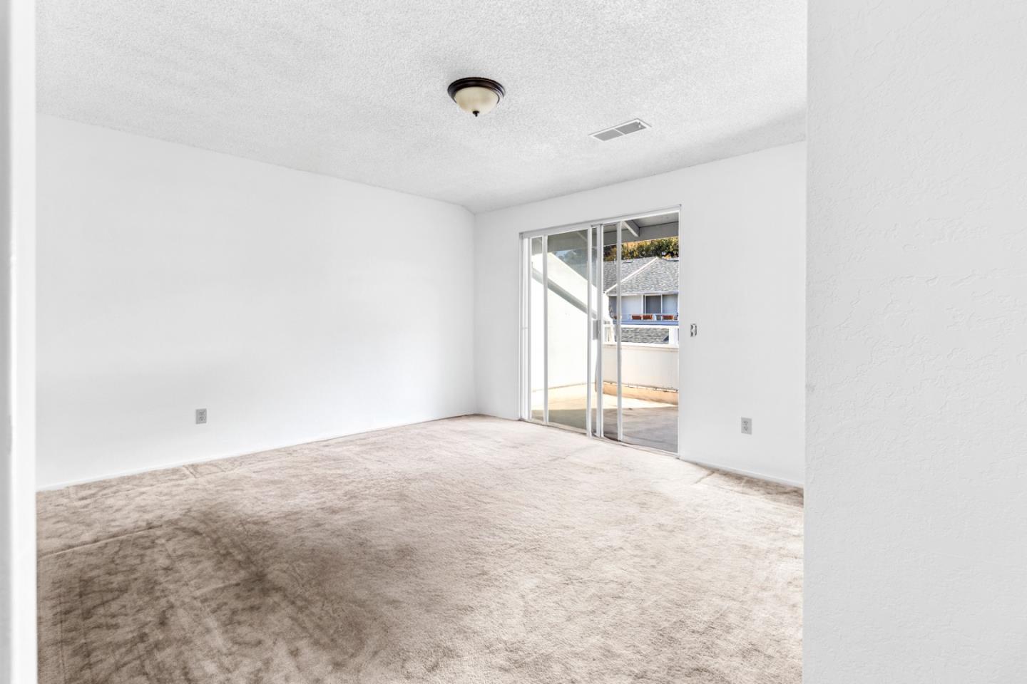 967 Hilby Avenue, Unit C Seaside, CA 93955 - Photo 16 of 24 a view of empty room with wooden floor and fan