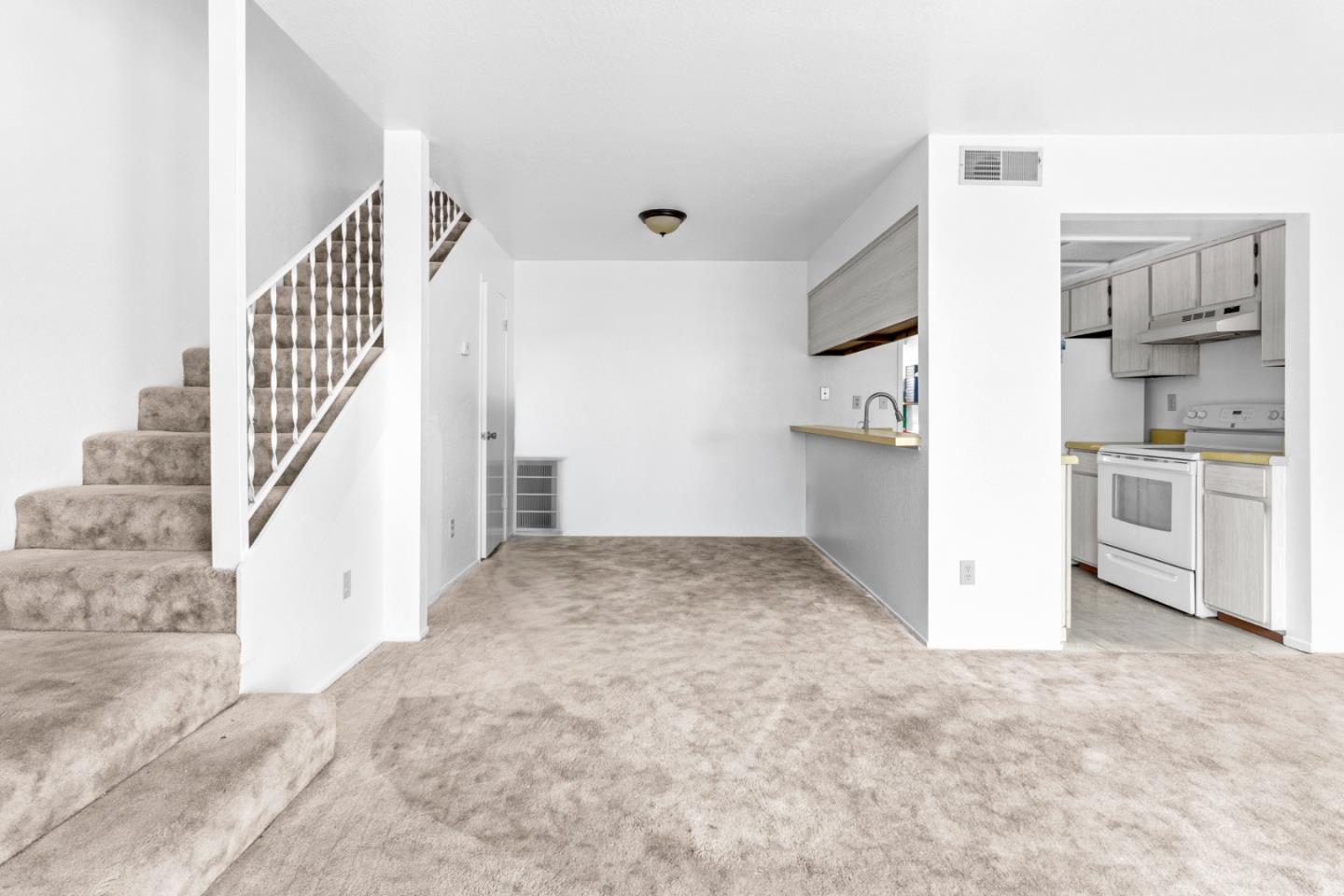 967 Hilby Avenue, Unit C Seaside, CA 93955 - Photo 7 of 24 a view of a kitchen with furniture and an empty room