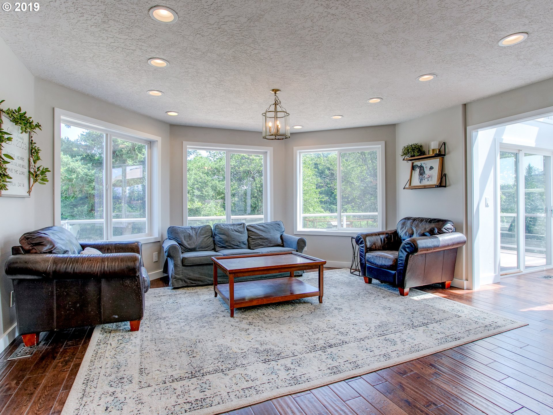 417 Northeast 299th Street Ridgefield, WA 98642 - Photo 15 of 32 a living room with furniture and large windows