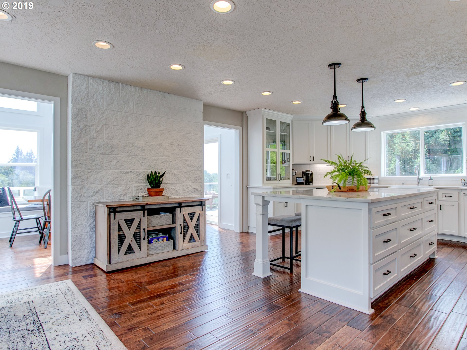 417 Northeast 299th Street Ridgefield, WA 98642 - Photo 18 of 32 a kitchen with stainless steel appliances granite countertop a stove a sink and a refrigerator