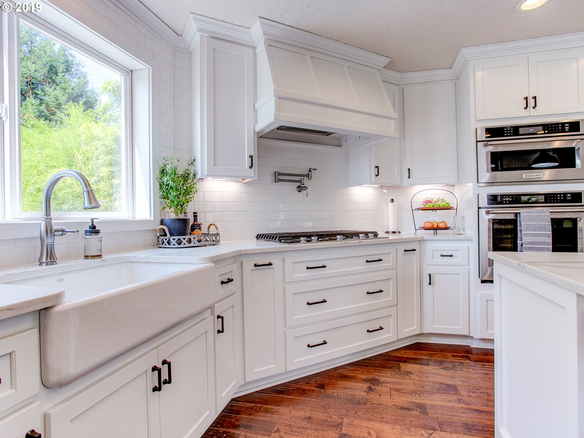 417 Northeast 299th Street Ridgefield, WA 98642 - Photo 20 of 32 a kitchen with cabinets appliances and a window