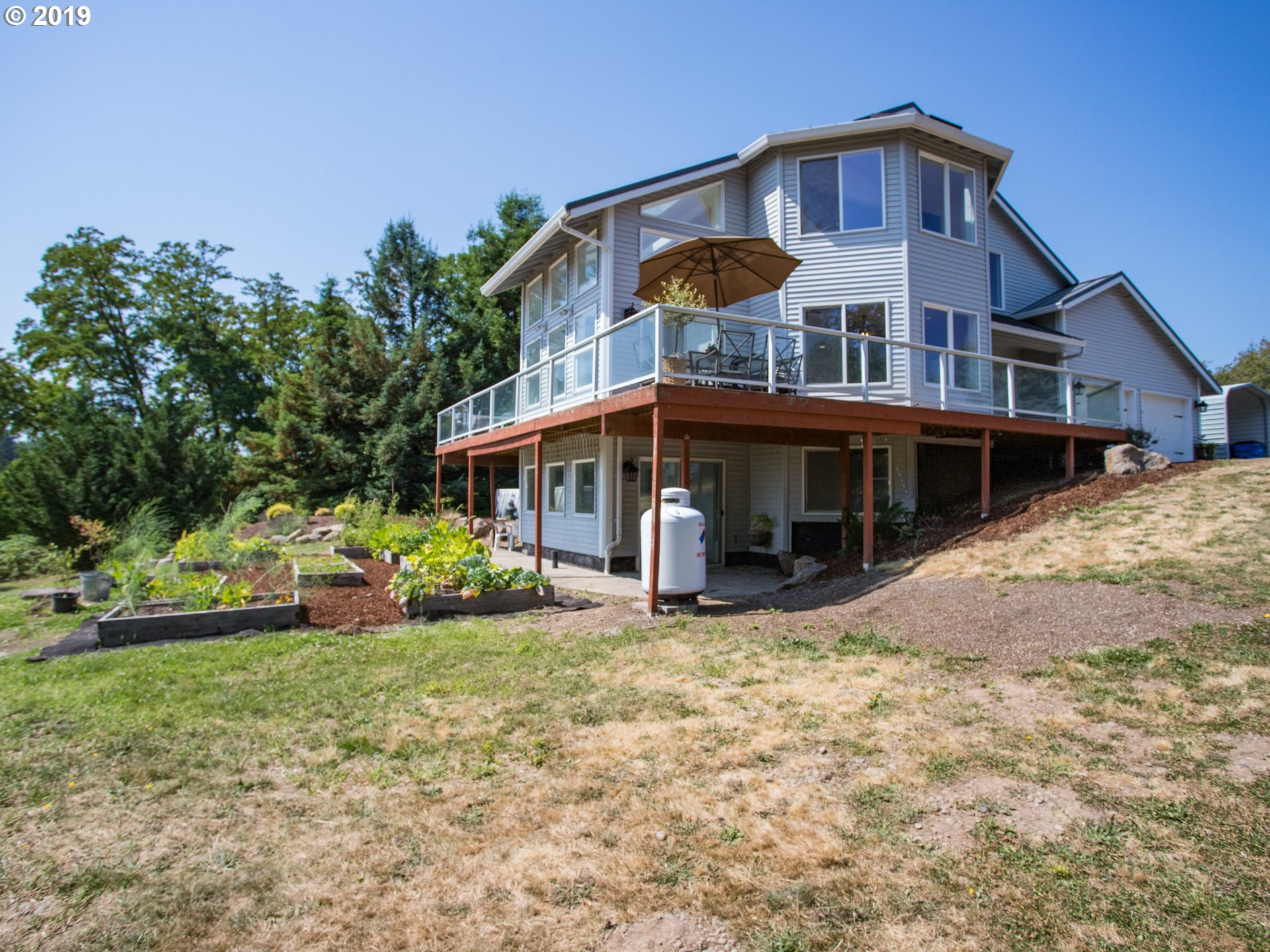 417 Northeast 299th Street Ridgefield, WA 98642 - Photo 2 of 32 a view of a house with yard and sitting area