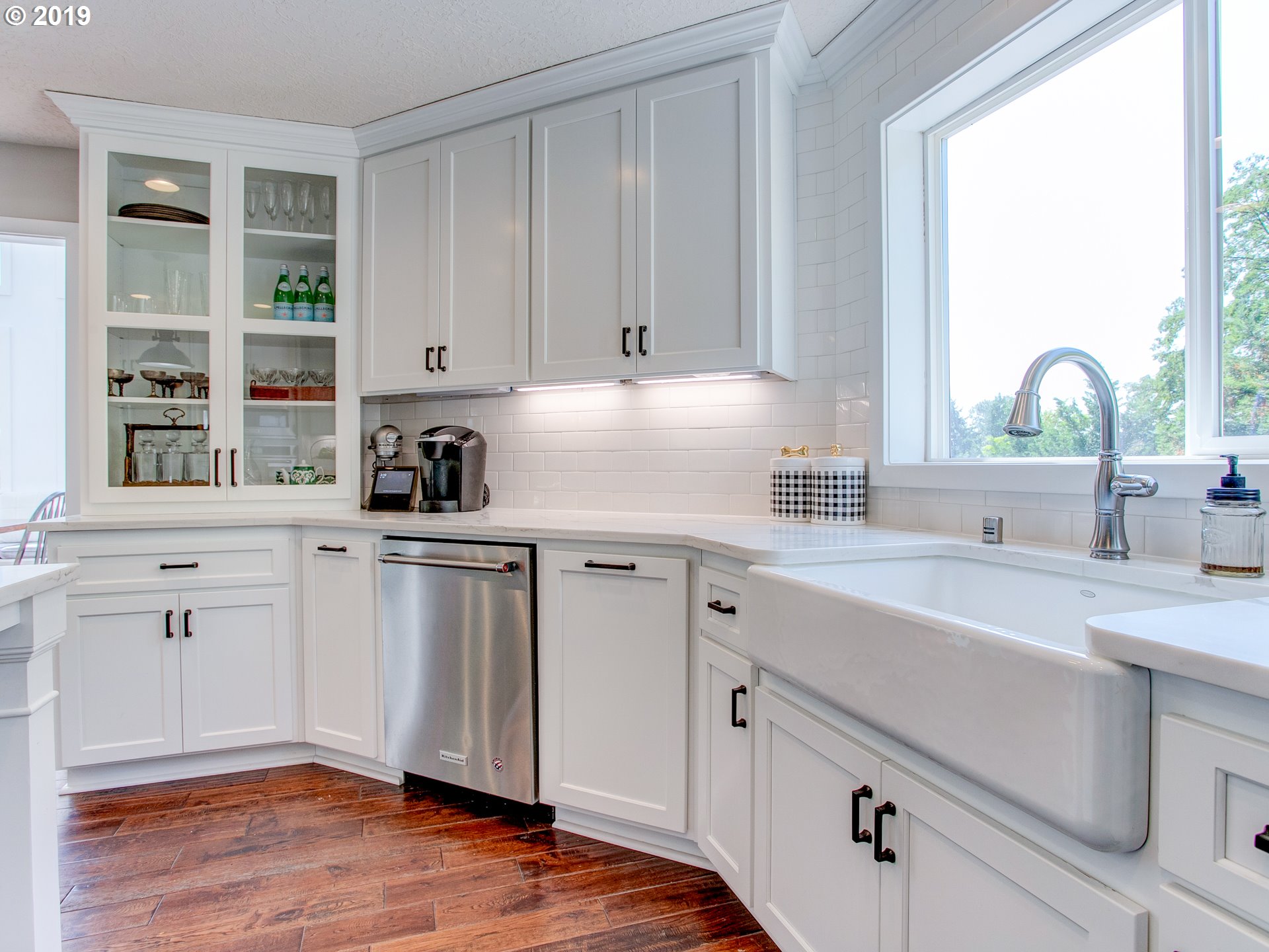 417 Northeast 299th Street Ridgefield, WA 98642 - Photo 22 of 32 a kitchen with cabinets appliances a sink and a window