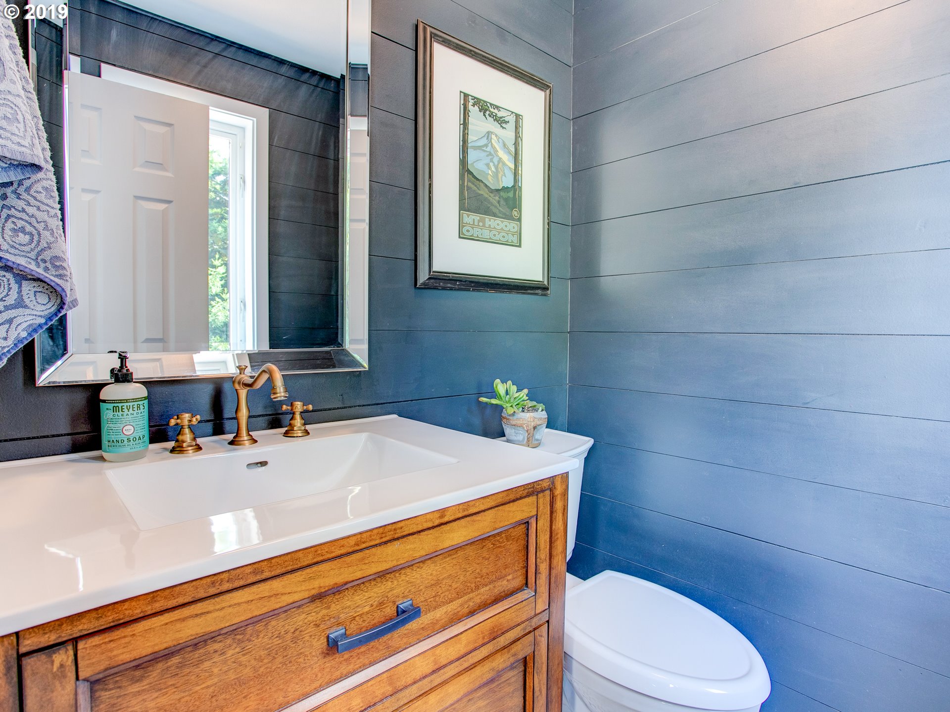 417 Northeast 299th Street Ridgefield, WA 98642 - Photo 25 of 32 a bathroom with a sink a toilet and mirror
