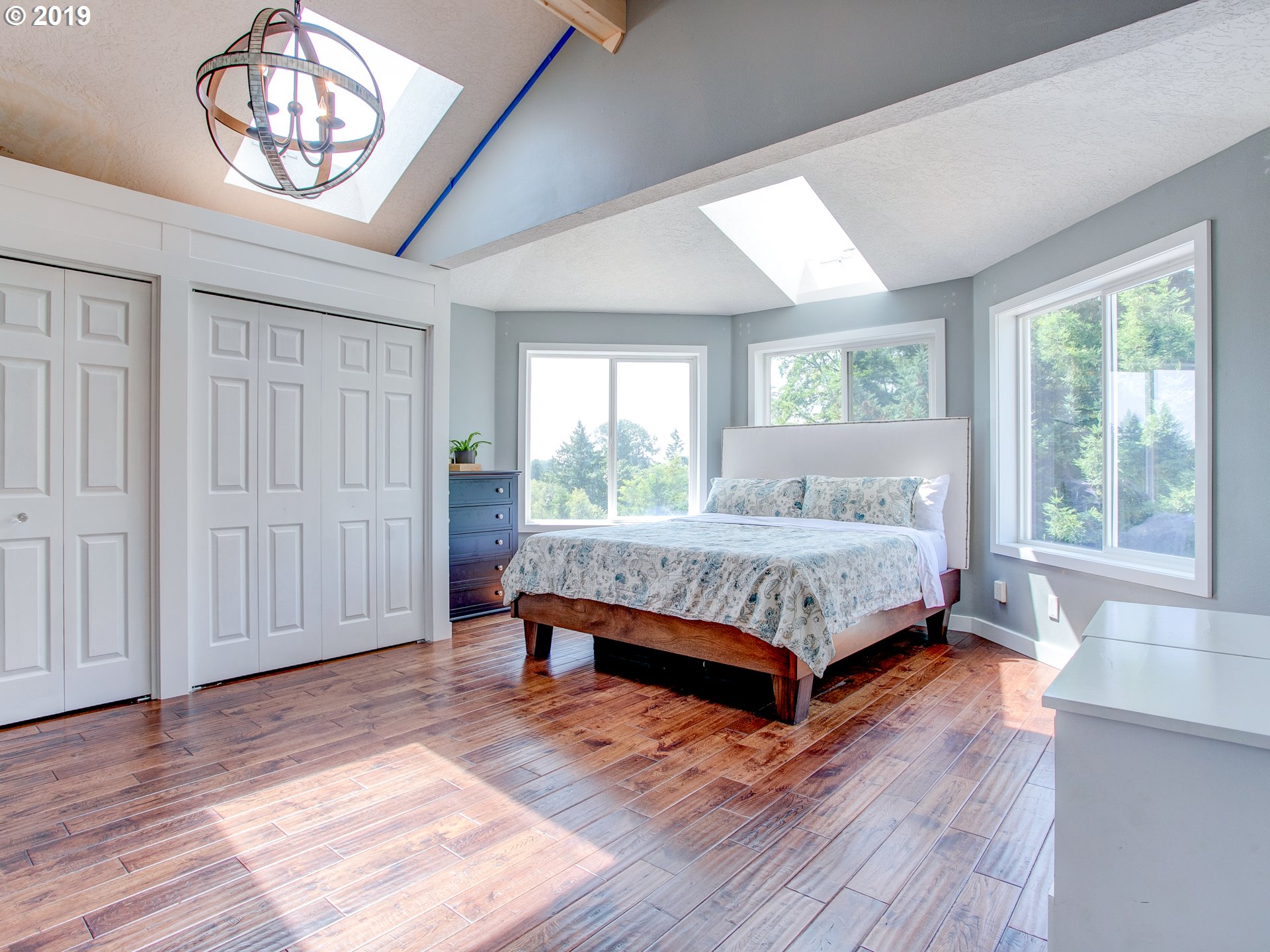 417 Northeast 299th Street Ridgefield, WA 98642 - Photo 26 of 32 a bed sitting in a spacious bedroom next to a window