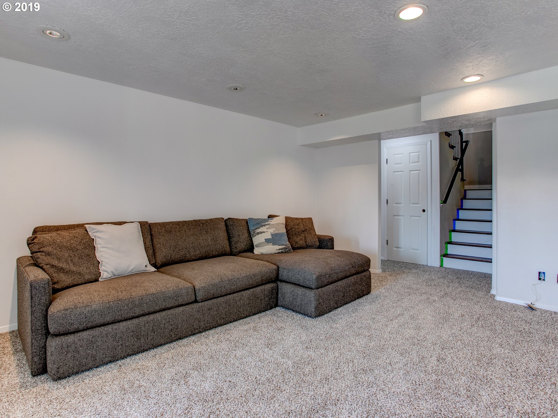 417 Northeast 299th Street Ridgefield, WA 98642 - Photo 30 of 32 a living room with furniture and a walk in closet