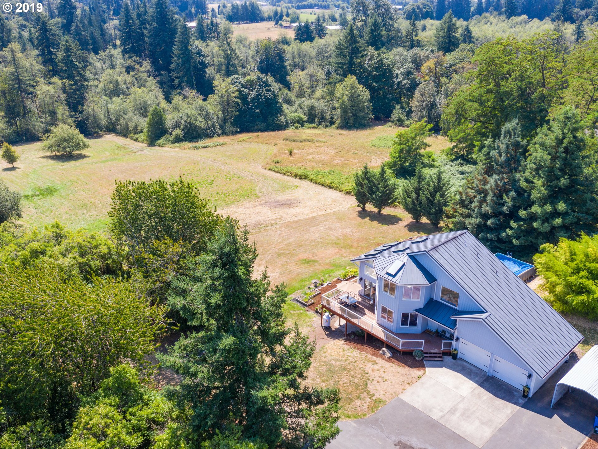 417 Northeast 299th Street Ridgefield, WA 98642 - Photo 10 of 32 an aerial view of a house with yard swimming pool and outdoor seating