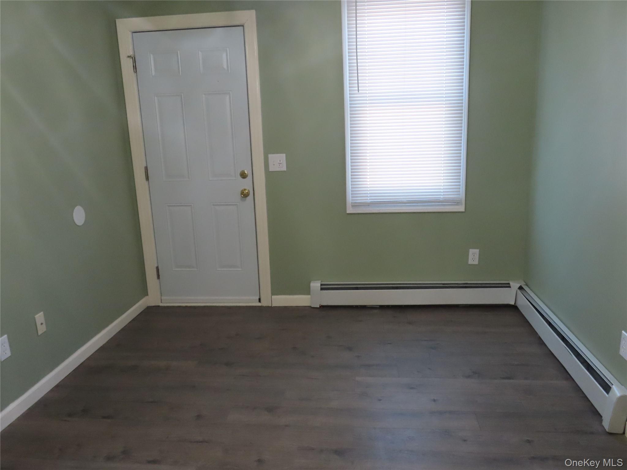 44 Terry Street Patchogue, NY 11772 - Photo 6 of 15 an empty room with a window