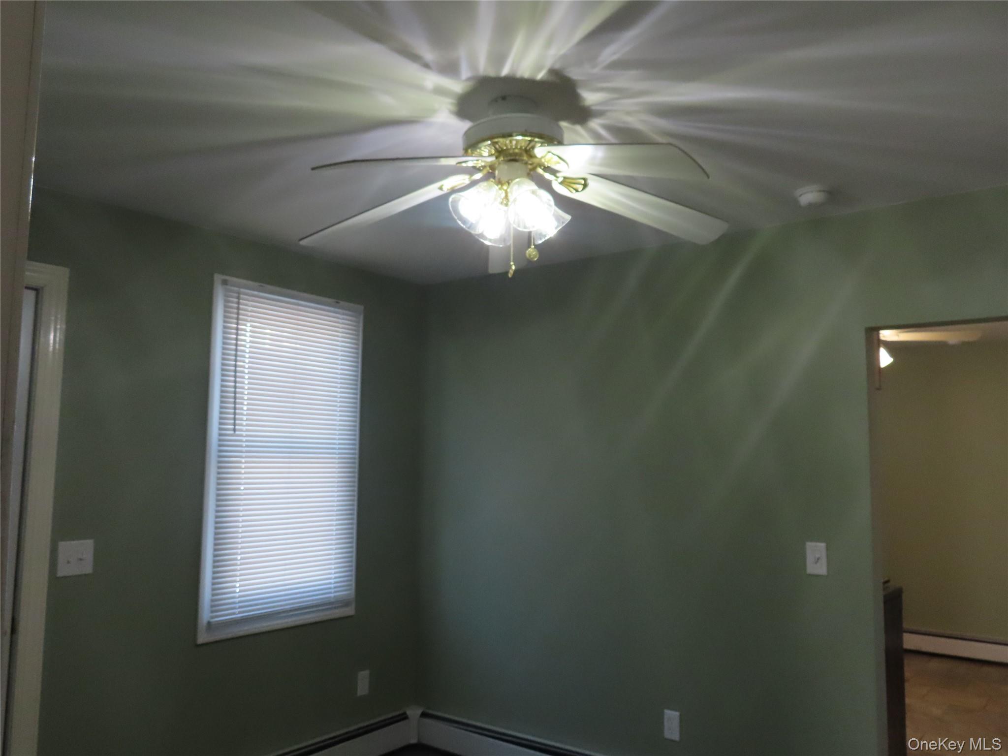 44 Terry Street Patchogue, NY 11772 - Photo 8 of 15 a window in an empty room