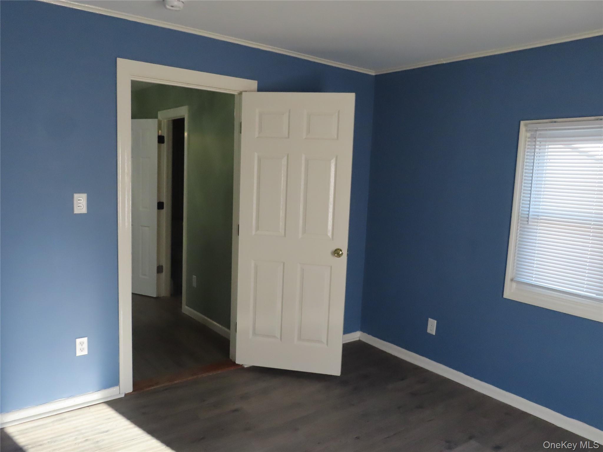 44 Terry Street Patchogue, NY 11772 - Photo 9 of 15 an empty room with windows and closet