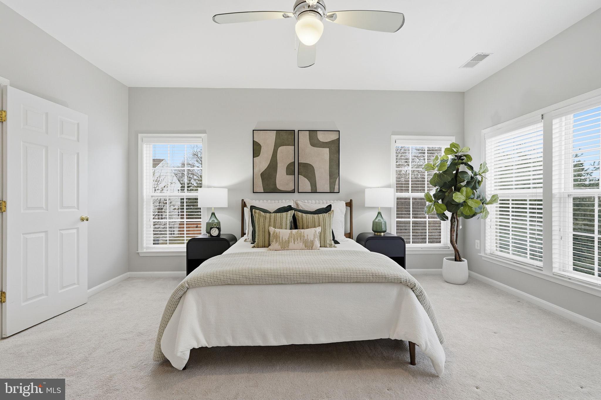 46600 Chase View Terrace Sterling, VA 20164 - Photo 14 of 38 a bedroom with a large bed and a chandelier