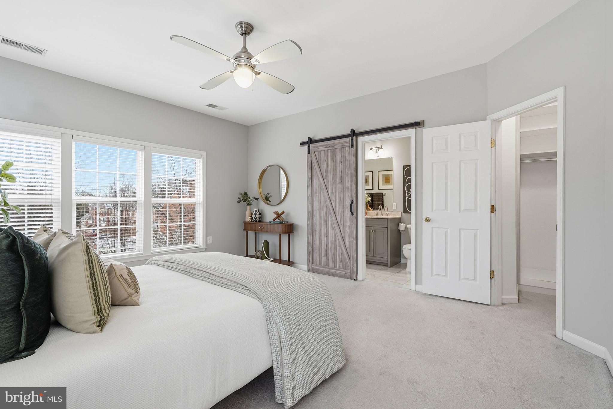 46600 Chase View Terrace Sterling, VA 20164 - Photo 17 of 38 a bedroom with a large bed and a large window