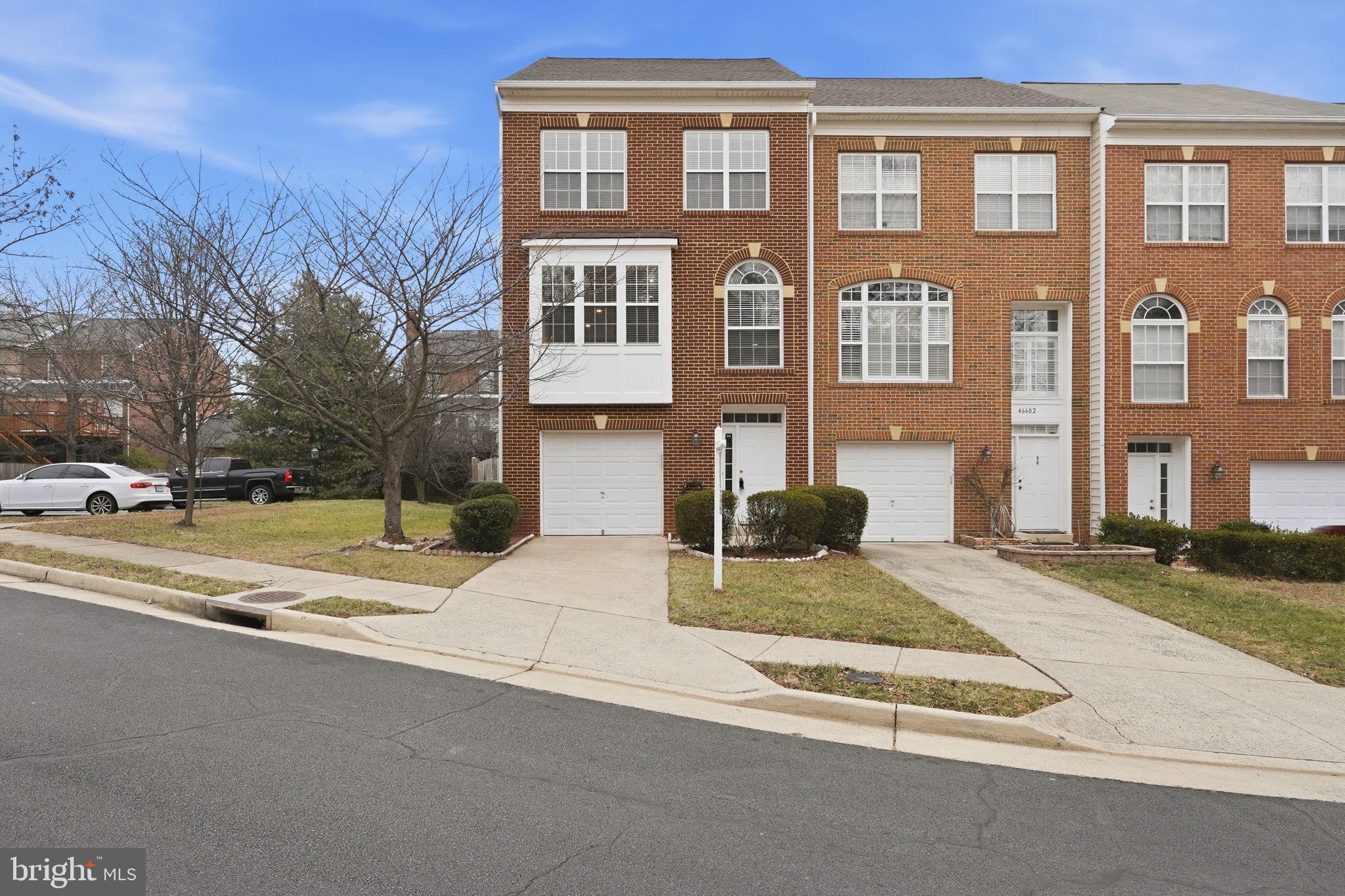 46600 Chase View Terrace Sterling, VA 20164 - Photo 2 of 38 a front view of a house with a yard
