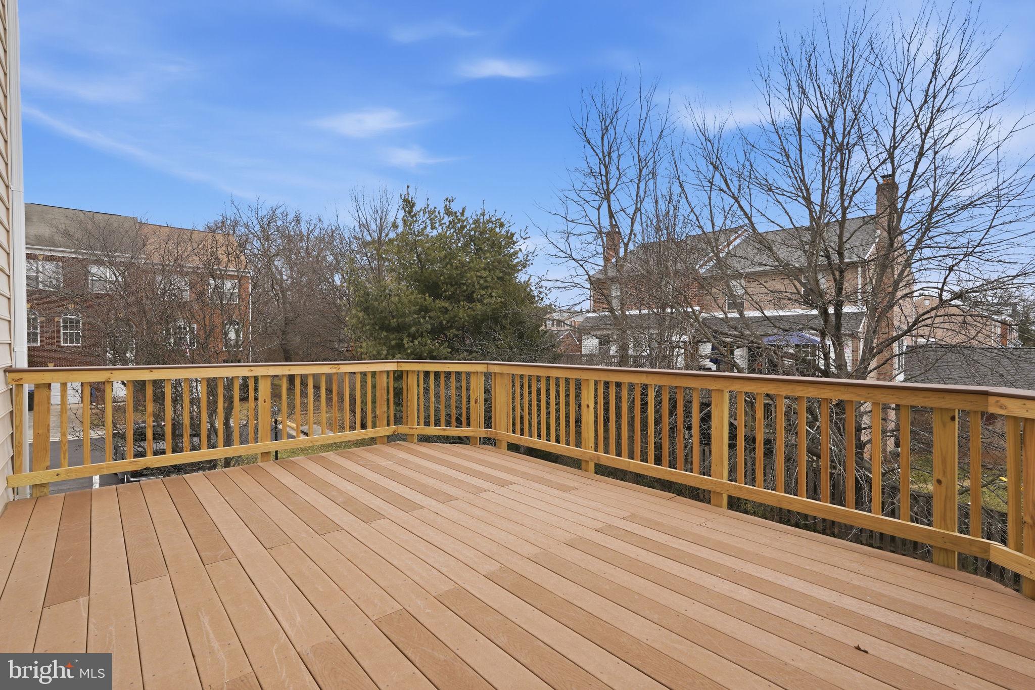 46600 Chase View Terrace Sterling, VA 20164 - Photo 32 of 38 a view of balcony with wooden floor and fence