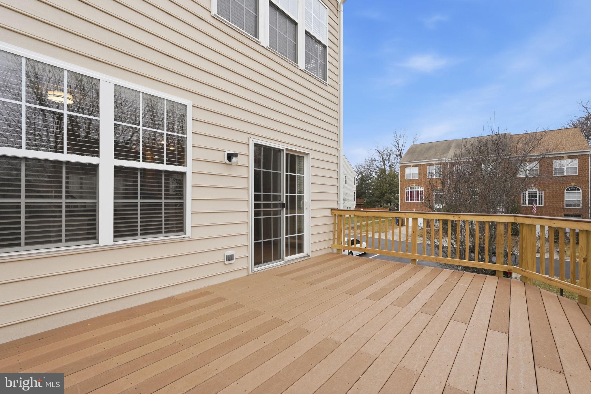 46600 Chase View Terrace Sterling, VA 20164 - Photo 33 of 38 a view of a balcony with wooden floor and city view