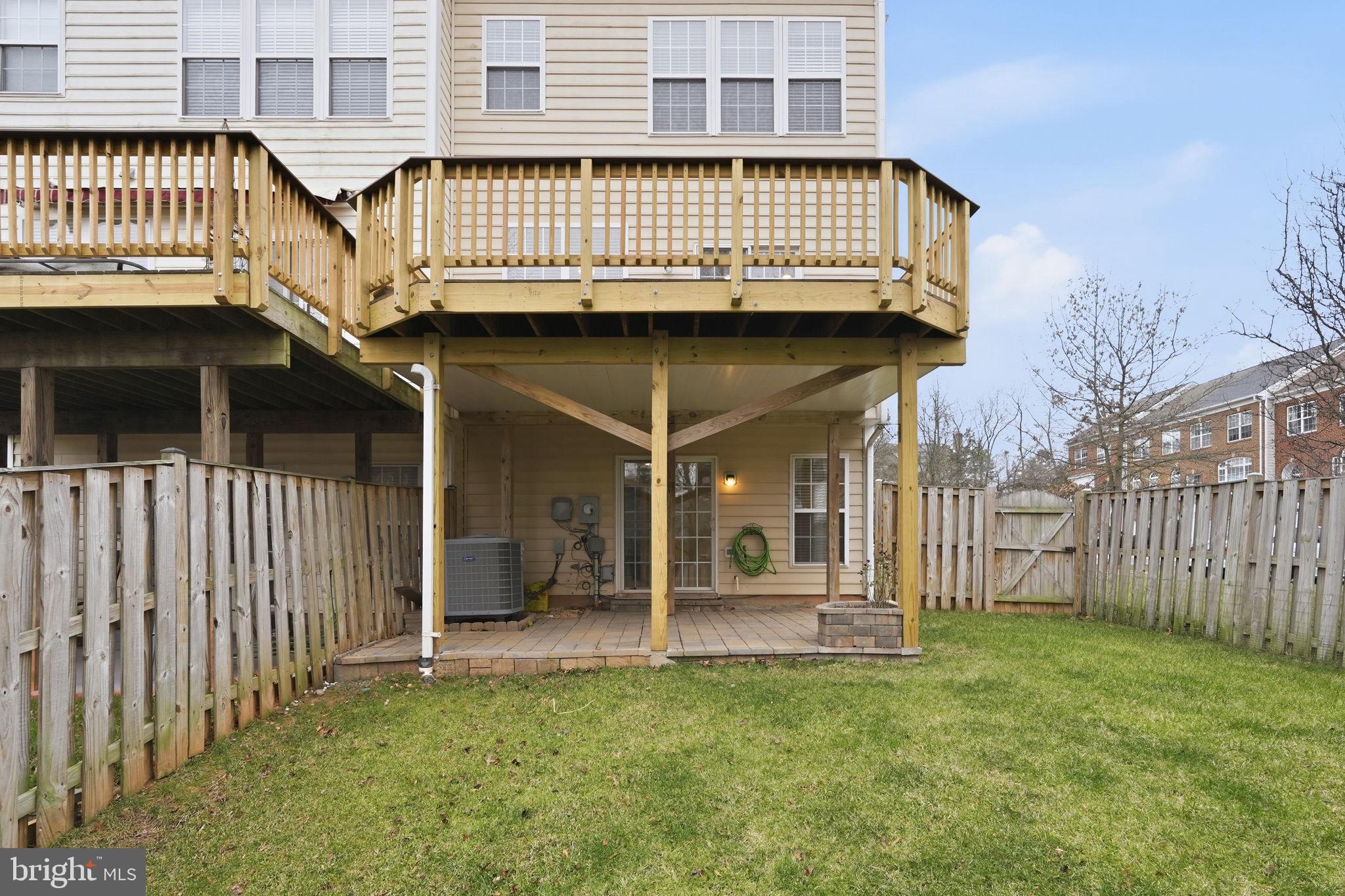 46600 Chase View Terrace Sterling, VA 20164 - Photo 34 of 38 a view of a brick house with a fence