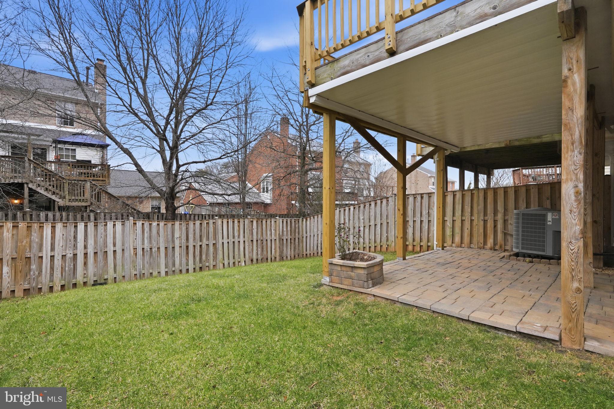 46600 Chase View Terrace Sterling, VA 20164 - Photo 36 of 38 a view of backyard with wooden fence and large trees