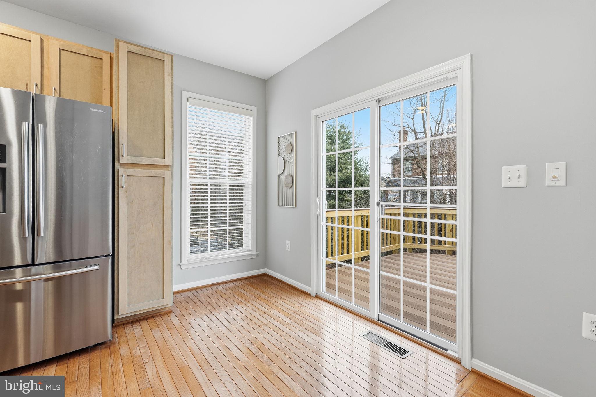 46600 Chase View Terrace Sterling, VA 20164 - Photo 10 of 38 a view of empty room with wooden floor and windows