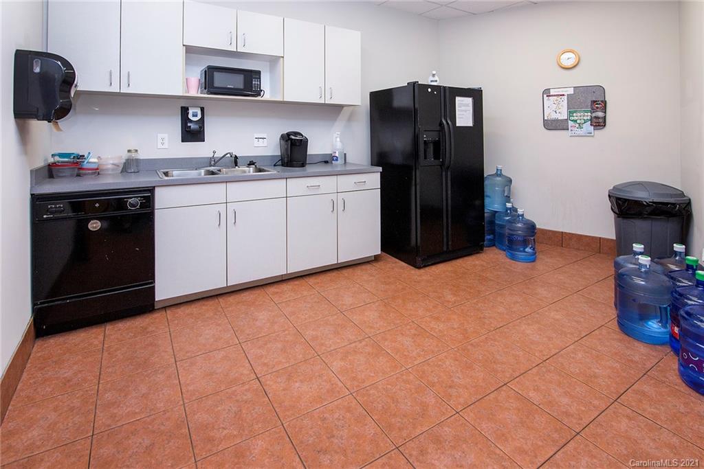 442 South Main Street, Unit 24 Davidson, NC 28036 - Photo 12 of 25 a kitchen with stainless steel appliances a sink and a refrigerator