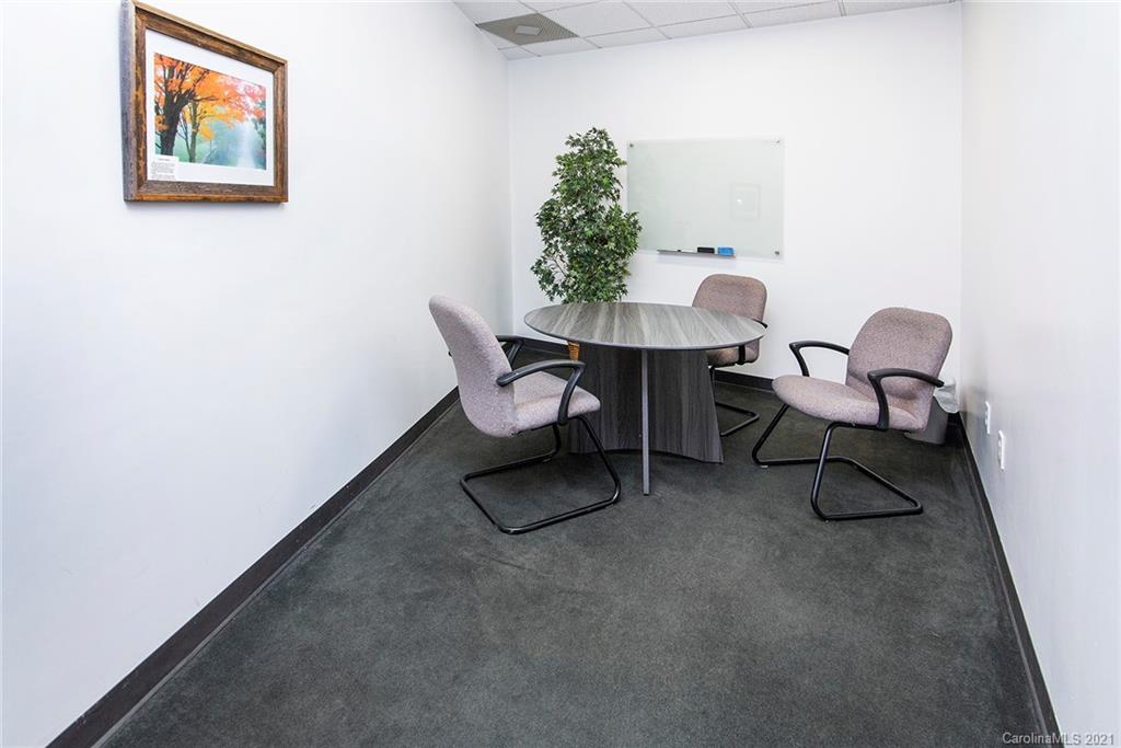 442 South Main Street, Unit 24 Davidson, NC 28036 - Photo 18 of 25 a workspace with furniture and a potted plant