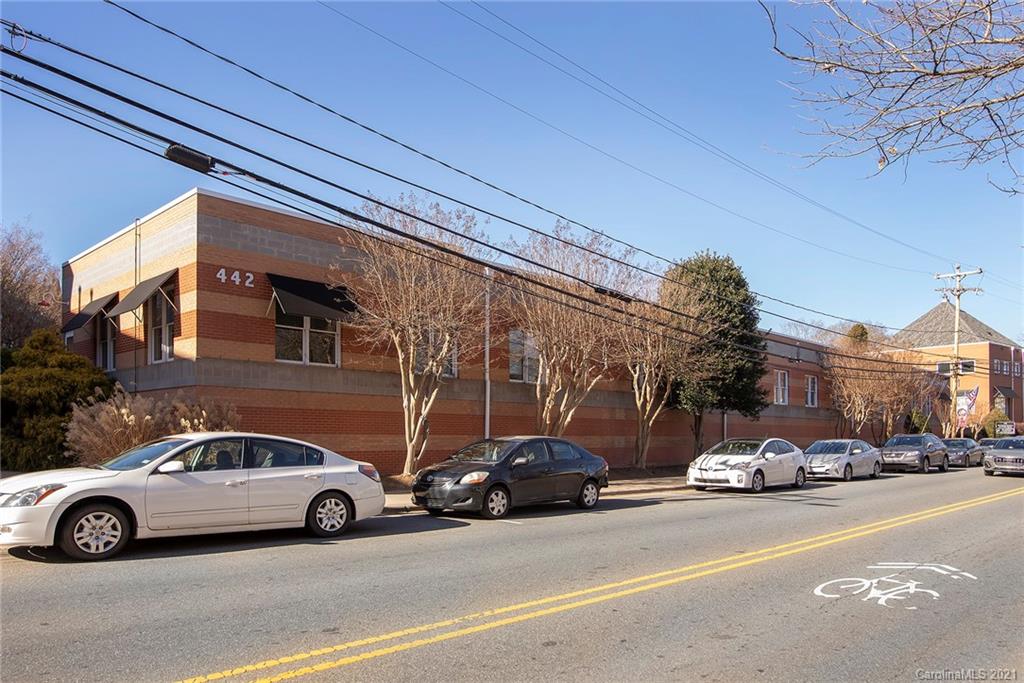 442 South Main Street, Unit 24 Davidson, NC 28036 - Photo 5 of 25 a view of a cars parked in front of a building