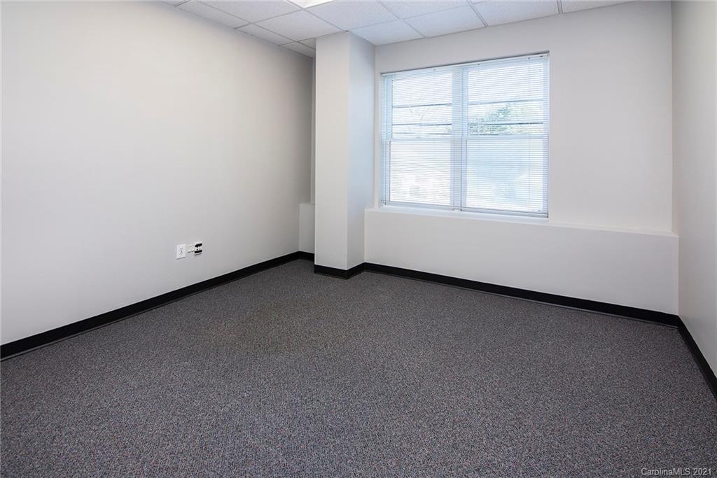 442 South Main Street, Unit 24 Davidson, NC 28036 - Photo 9 of 25 wooden floor in an empty room with a window