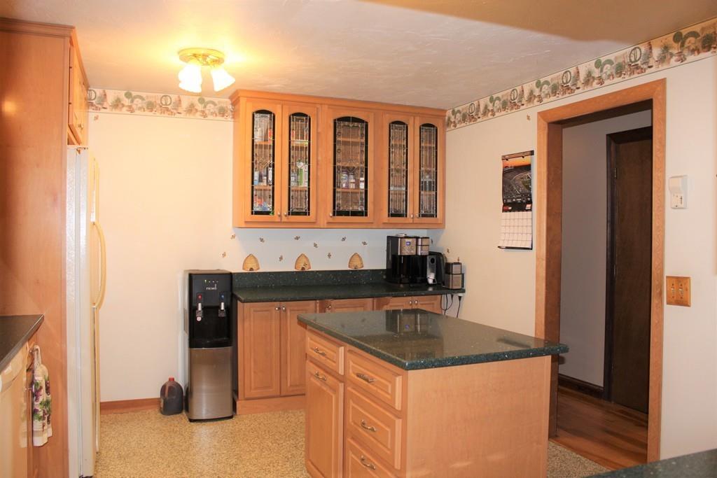 90 Vinton Road Holland, MA 01521 - Photo 9 of 39 a kitchen with a refrigerator and a sink