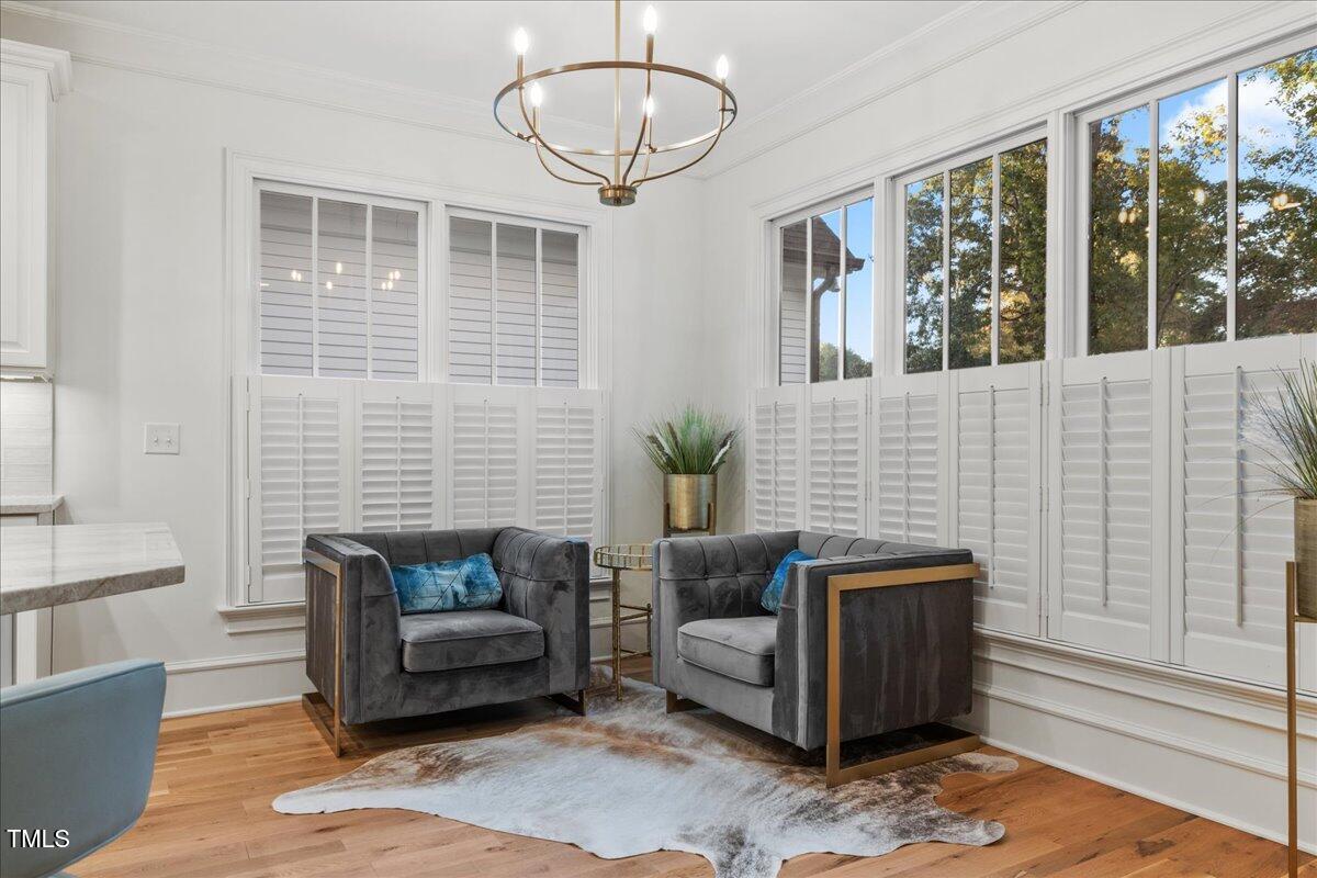 2926 Barmettler Street Raleigh, NC 27607 - Photo 17 of 74 a living room with furniture and windows