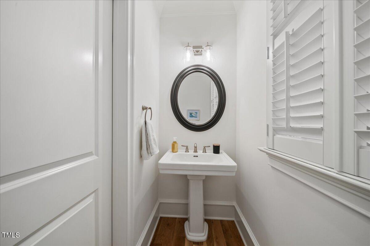 2926 Barmettler Street Raleigh, NC 27607 - Photo 19 of 74 a bathroom with a sink toilet and a mirror