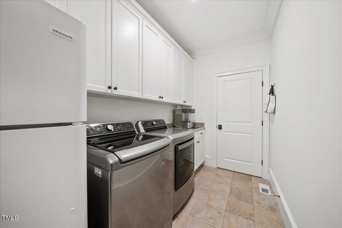 2926 Barmettler Street Raleigh, NC 27607 - Photo 24 of 74 a kitchen with a stove and a refrigerator