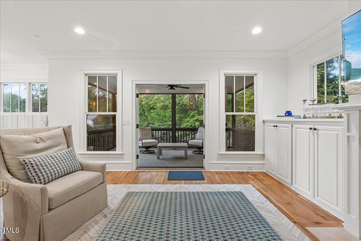 2926 Barmettler Street Raleigh, NC 27607 - Photo 31 of 74 a living room with furniture and a rug