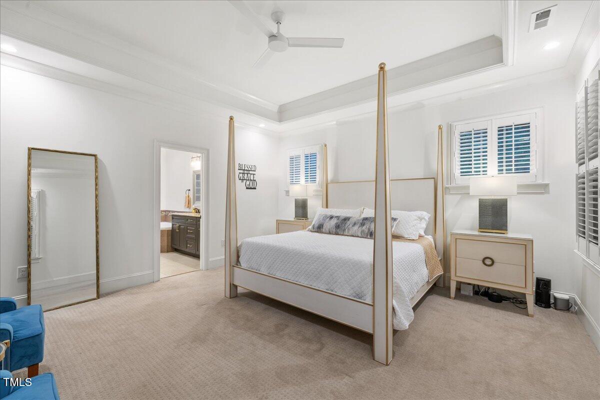 2926 Barmettler Street Raleigh, NC 27607 - Photo 37 of 74 a spacious bedroom with a bed and a dresser