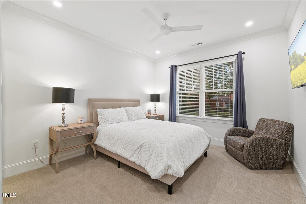 2926 Barmettler Street Raleigh, NC 27607 - Photo 50 of 74 a bedroom with a bed and a window