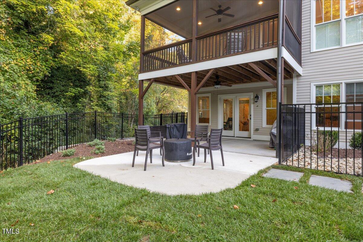 2926 Barmettler Street Raleigh, NC 27607 - Photo 64 of 74 a view of outdoor dining space with a patio and a garden