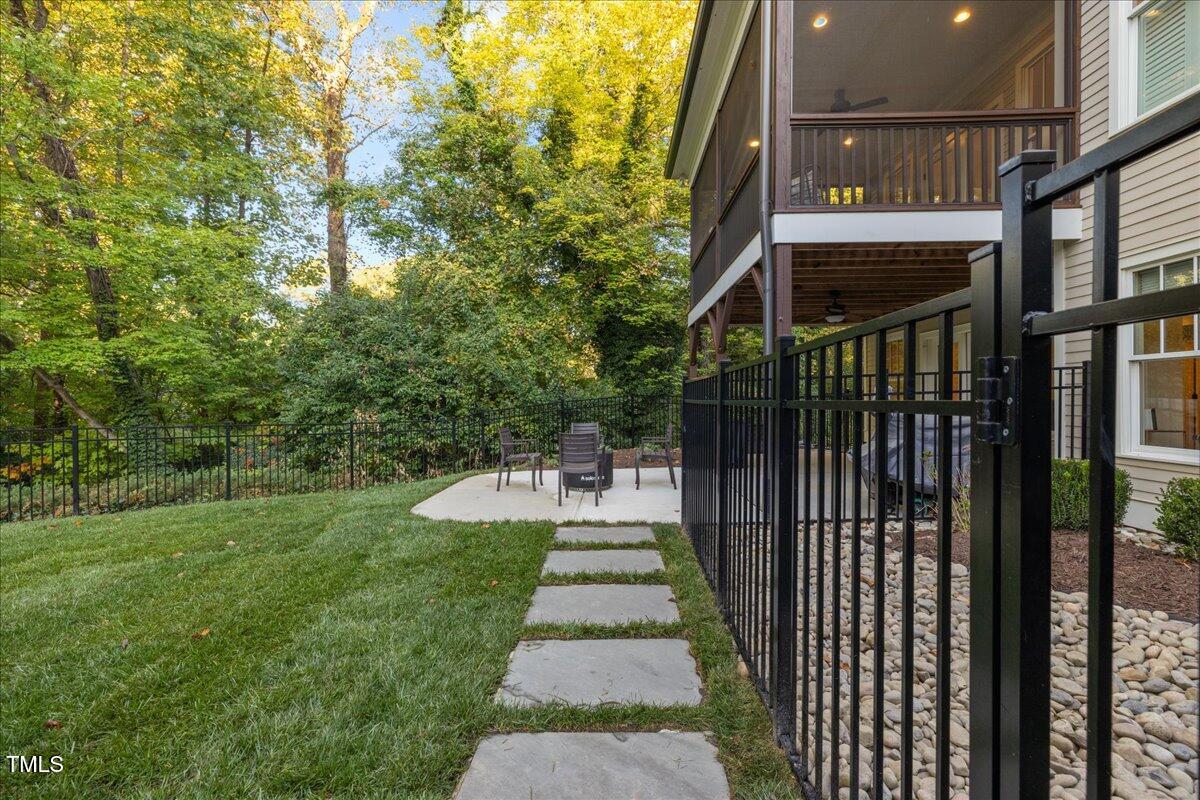 2926 Barmettler Street Raleigh, NC 27607 - Photo 67 of 74 a view of a pathway of a house with a yard