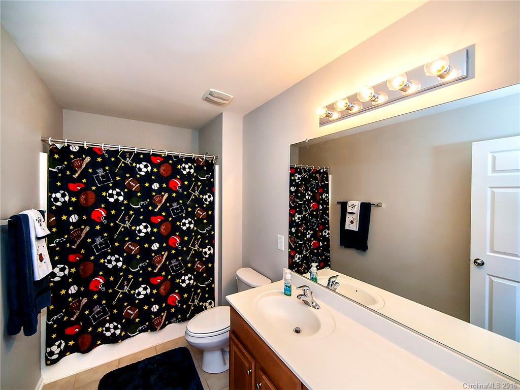 623 Panthers Way Fort Mill, SC 29708 - Photo 19 of 24 a bathroom with a sink toilet and shower