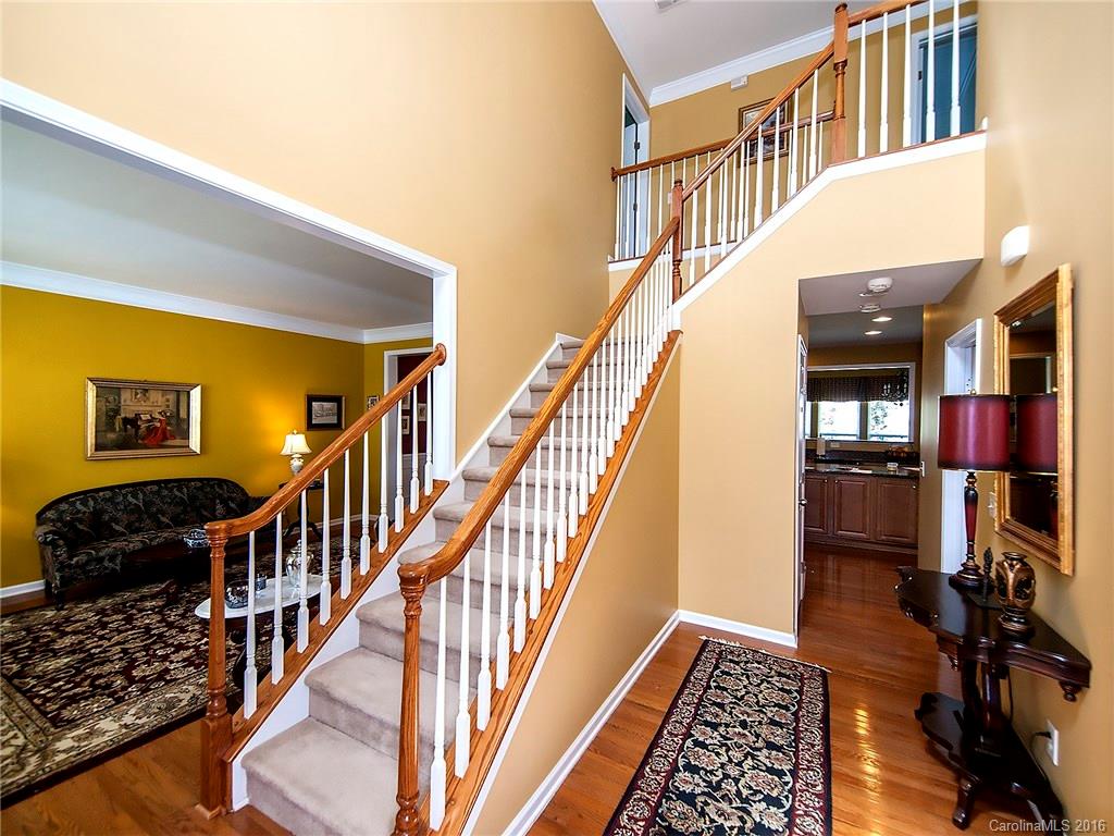 623 Panthers Way Fort Mill, SC 29708 - Photo 3 of 24 a view of staircase with lots of frames on wall and a window