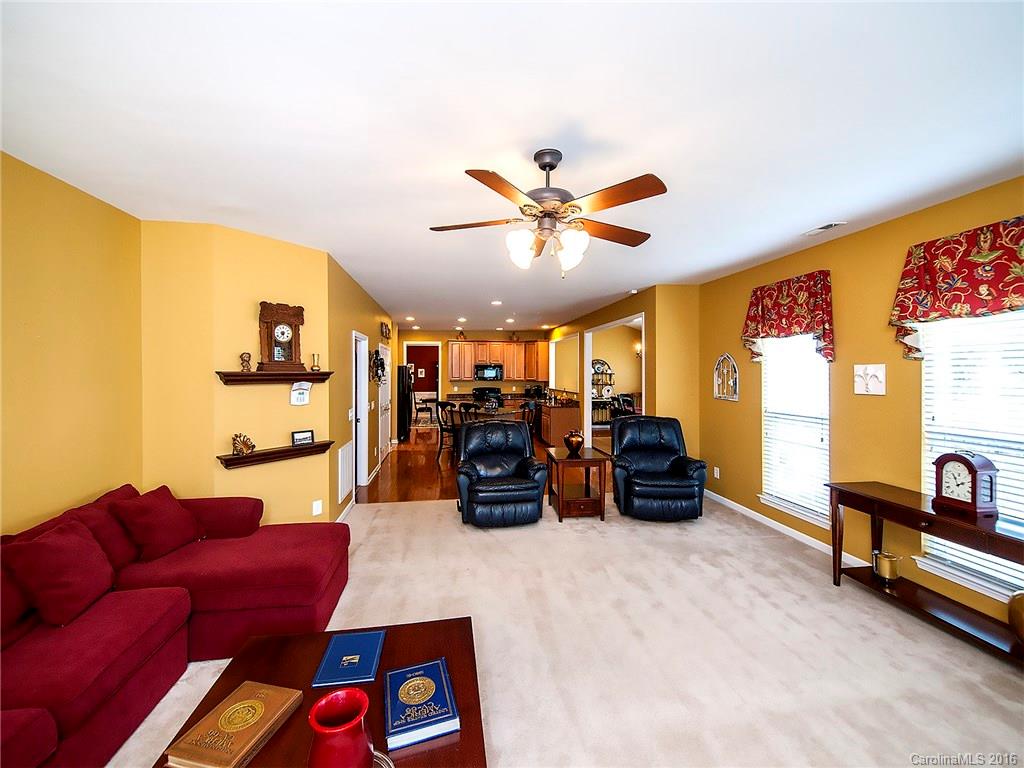 623 Panthers Way Fort Mill, SC 29708 - Photo 9 of 24 a living room with furniture and a flat screen tv