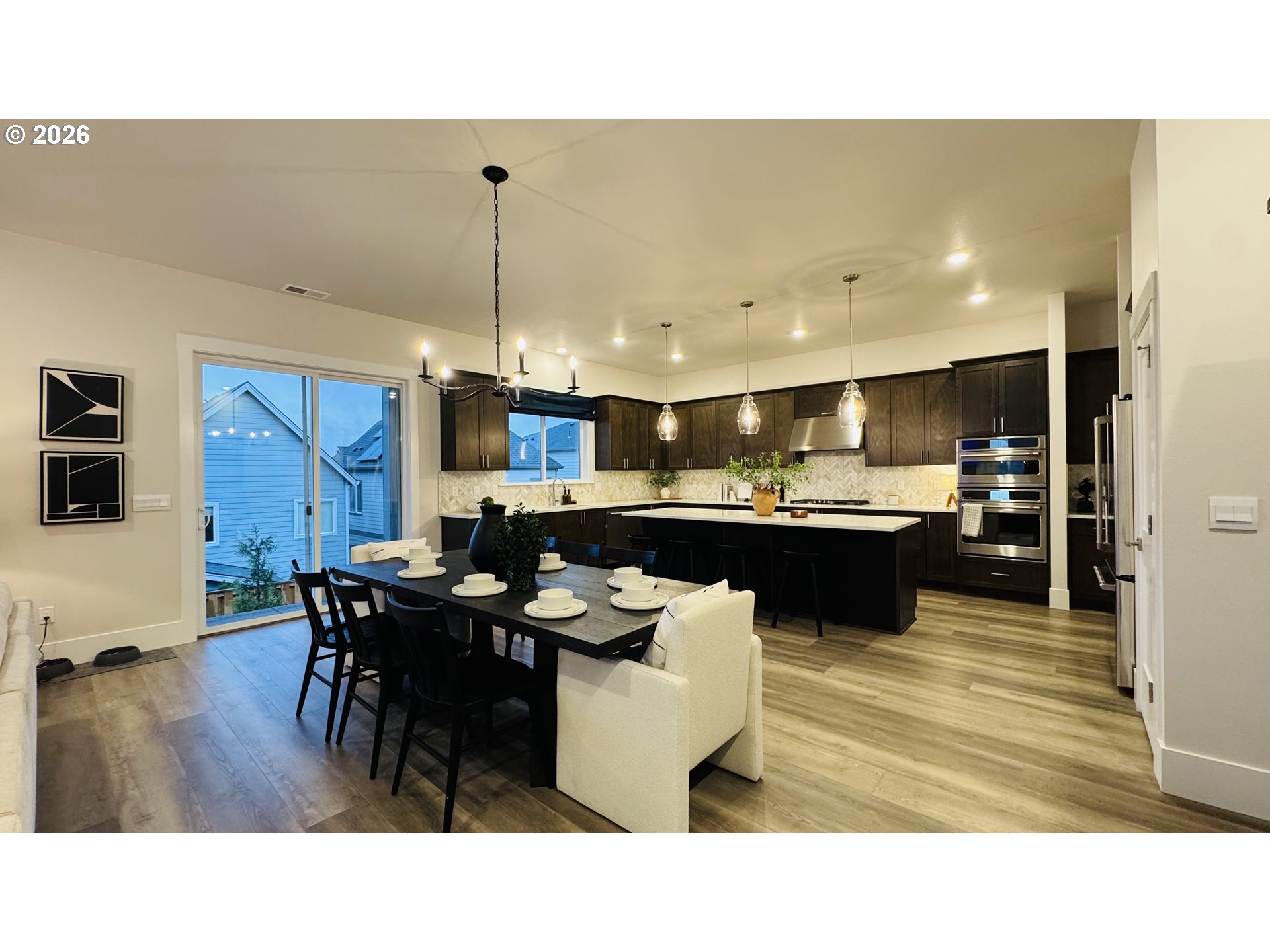 11651 Southwest Hayrick Terrace Beaverton, OR 97007 - Photo 12 of 44 a kitchen with a table and chairs in it