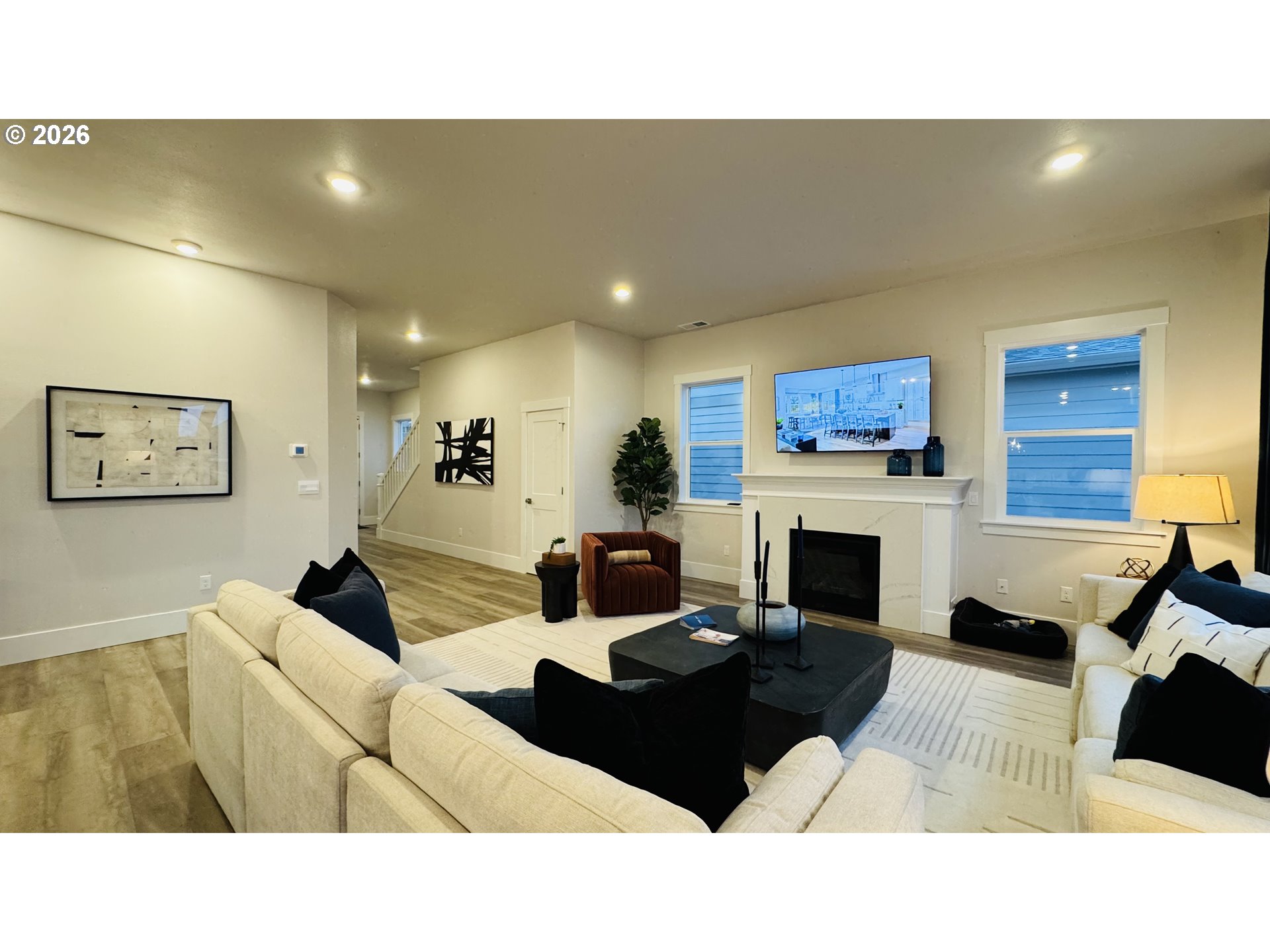 11651 Southwest Hayrick Terrace Beaverton, OR 97007 - Photo 13 of 44 a living room with furniture a fireplace and a flat screen tv