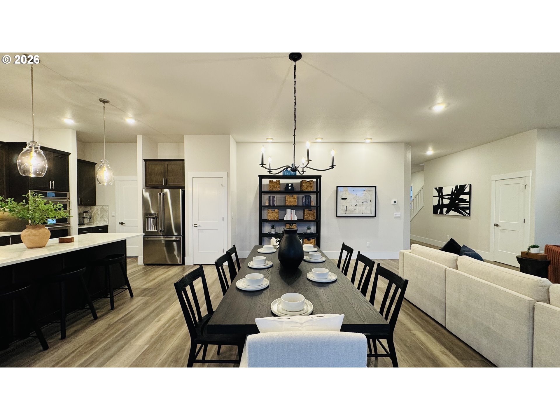 11651 Southwest Hayrick Terrace Beaverton, OR 97007 - Photo 15 of 44 a kitchen with a dining table chairs and view living room