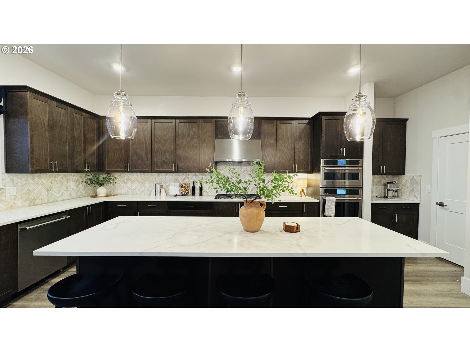11651 Southwest Hayrick Terrace Beaverton, OR 97007 - Photo 18 of 44 a kitchen with stainless steel appliances a sink counter space and cabinets