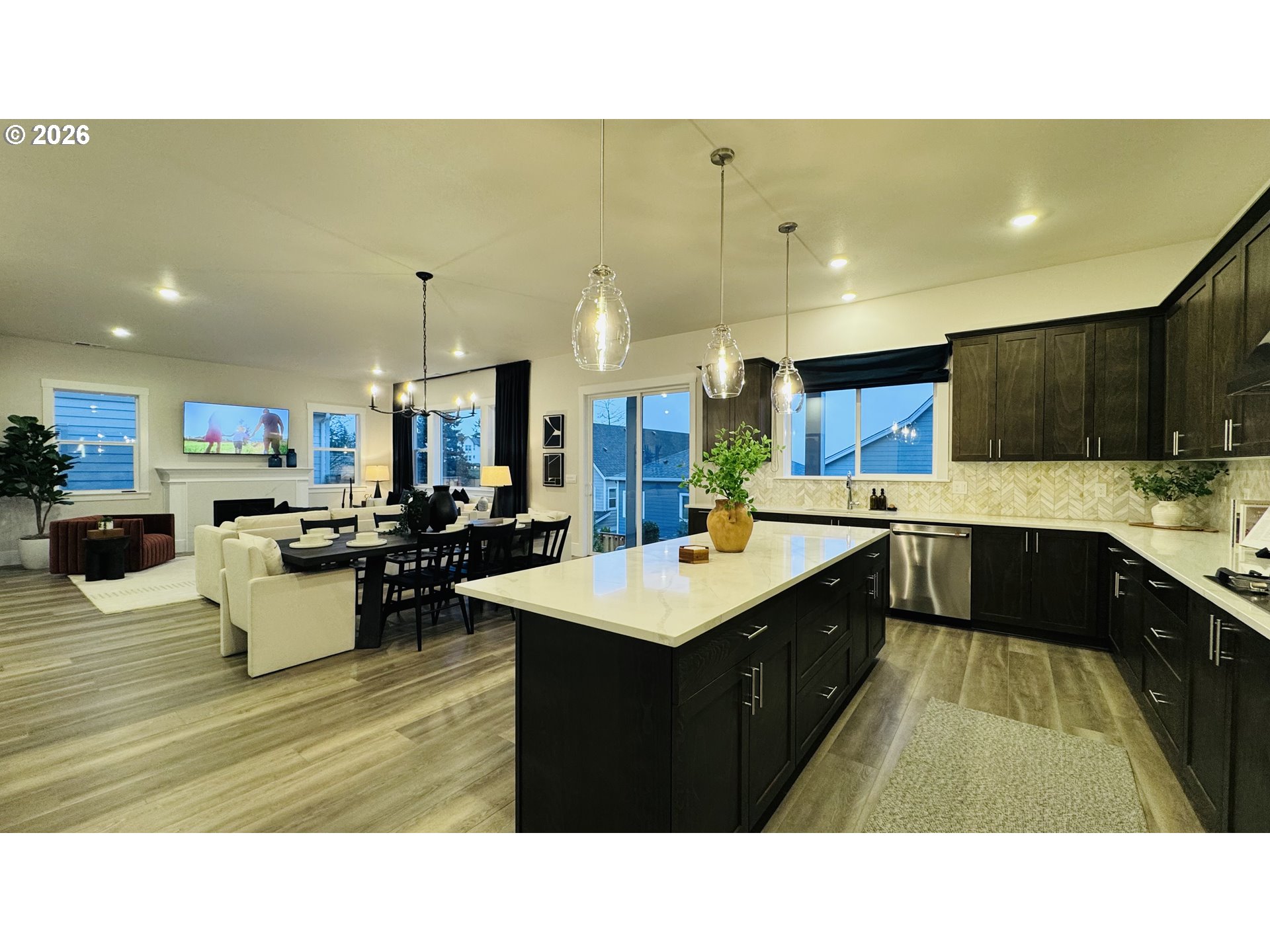 11651 Southwest Hayrick Terrace Beaverton, OR 97007 - Photo 24 of 44 a kitchen with kitchen island stainless steel appliances a sink counter space and a sink