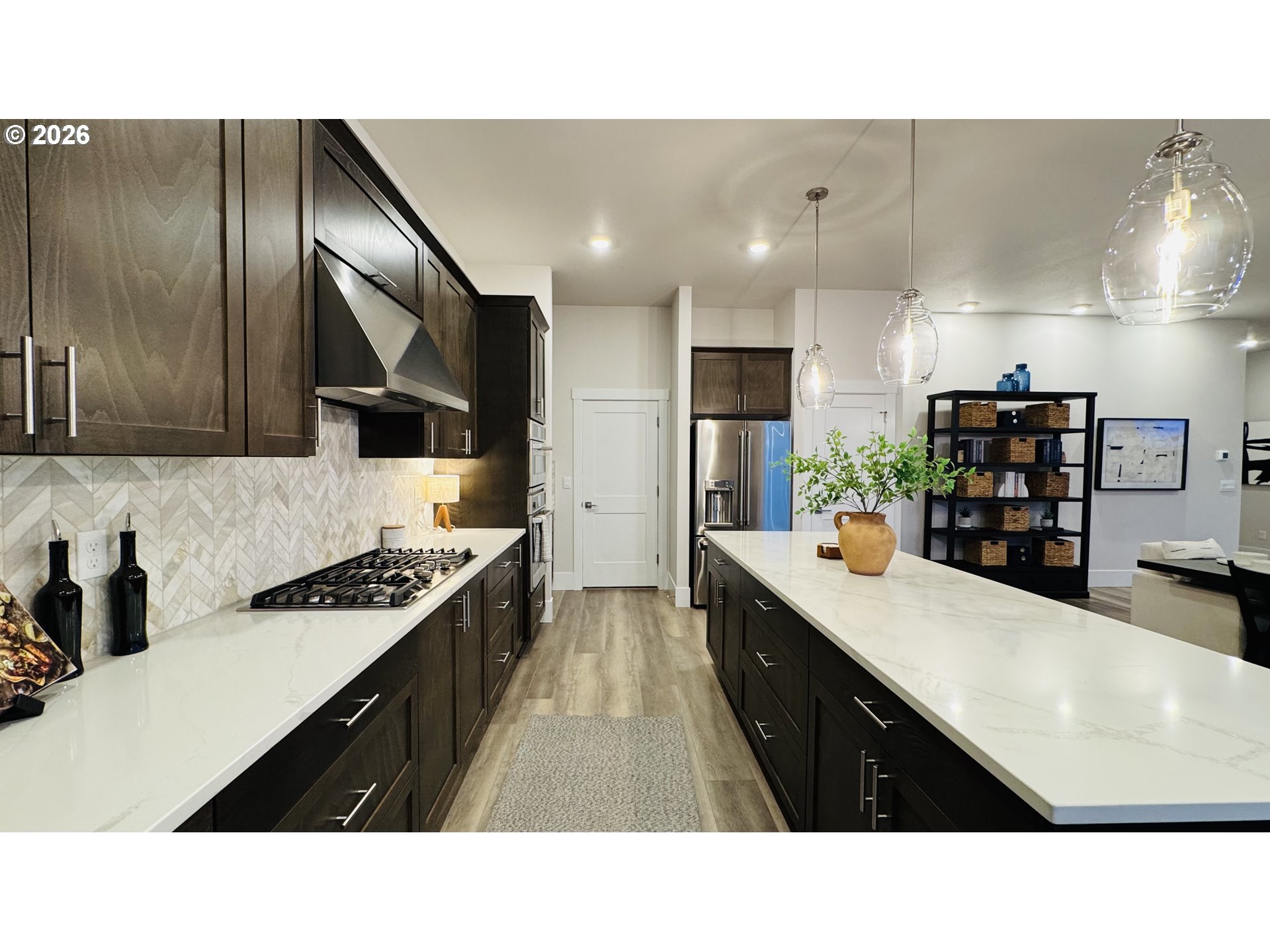 11651 Southwest Hayrick Terrace Beaverton, OR 97007 - Photo 27 of 44 a kitchen with stainless steel appliances a sink stove and refrigerator