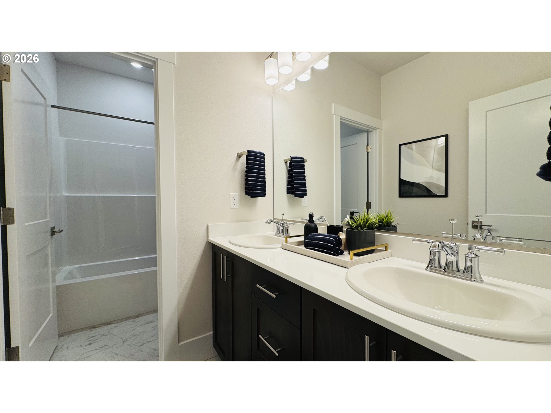 11651 Southwest Hayrick Terrace Beaverton, OR 97007 - Photo 35 of 44 a bathroom with a sink a double vanity and a mirror