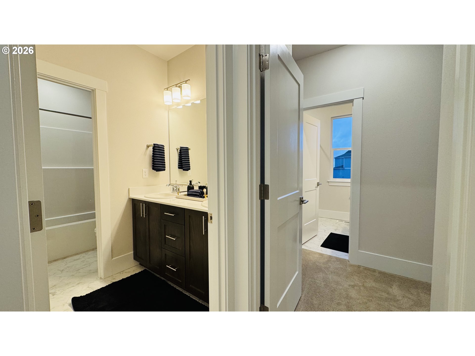 11651 Southwest Hayrick Terrace Beaverton, OR 97007 - Photo 36 of 44 a bathroom with a sink a mirror and shower