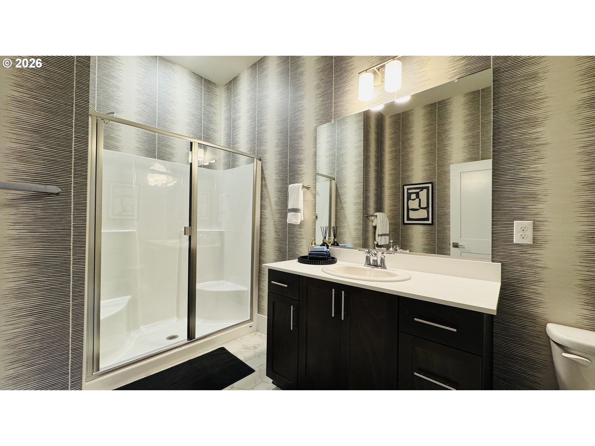 11651 Southwest Hayrick Terrace Beaverton, OR 97007 - Photo 6 of 44 a bathroom with a sink a mirror and a shower